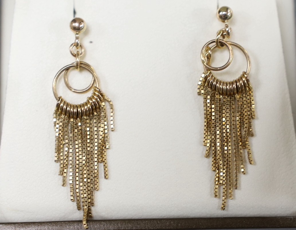 Three assorted modern pairs of yellow metal earrings, including tassel drop, 9ct gold and three stone sapphire (lacking butterflies) and 375 garnet and diamond chip